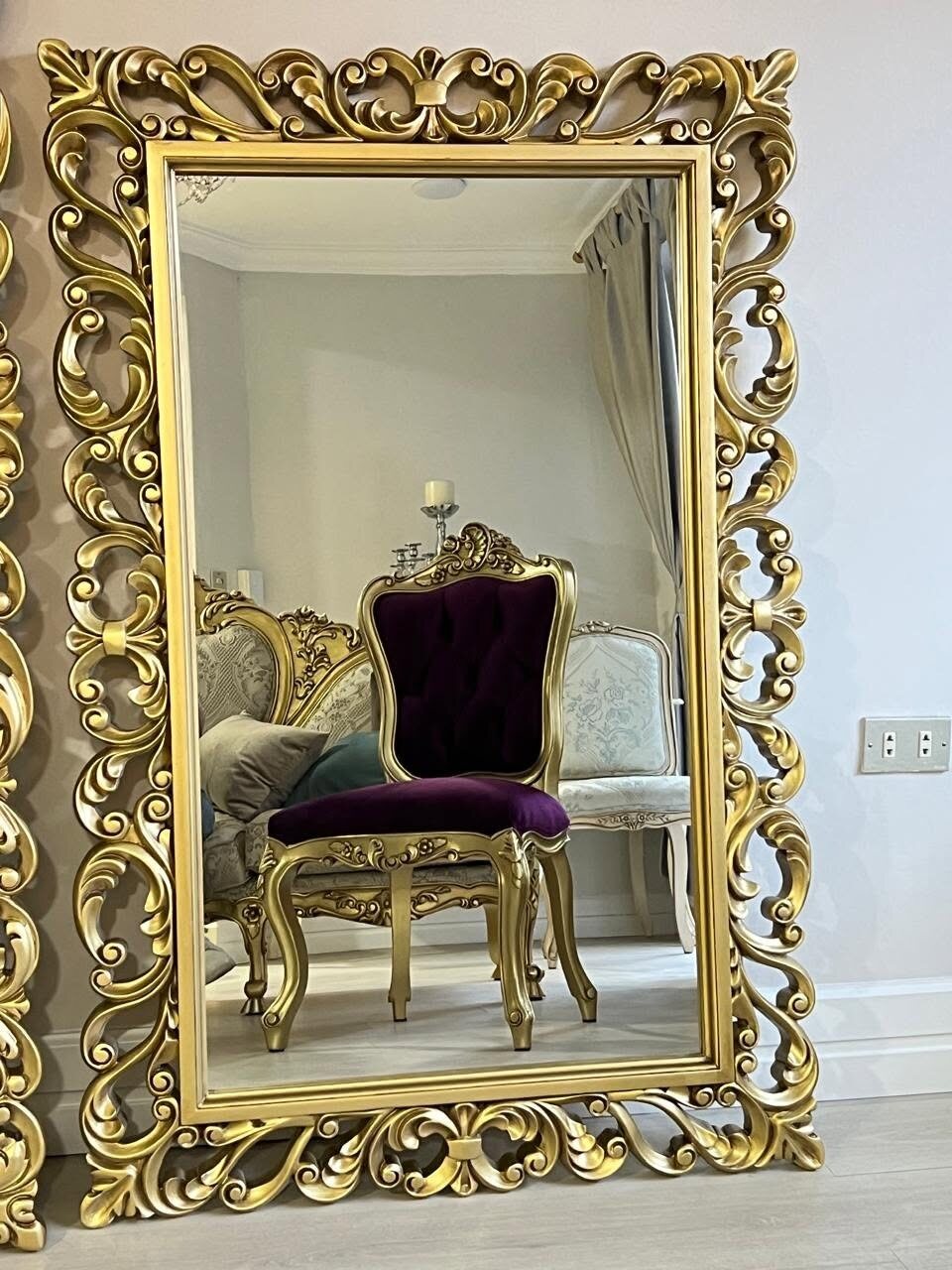 Vertical Versailles mirror with a gilded carved frame